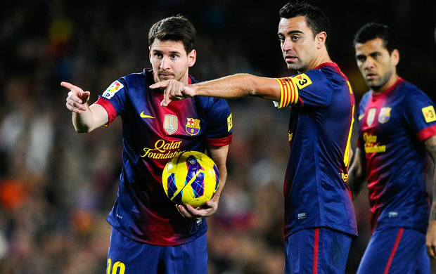 Messi e Xavi são os donos da bola no Barcelona (Foto: Getty Images)